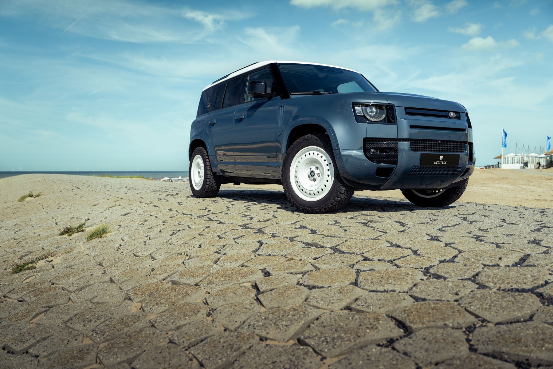 Defender 110 P400e - Tasman blue with white roof