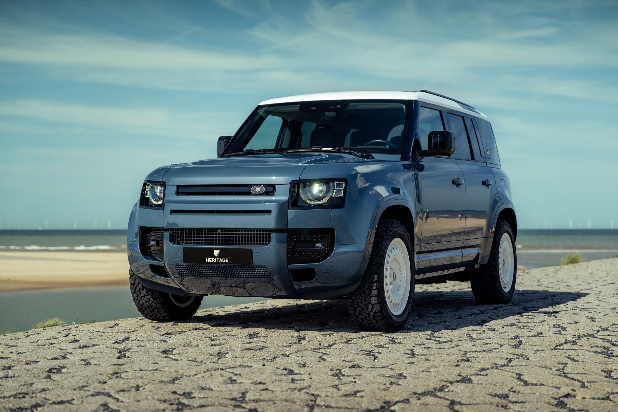 Defender 110 P400e - Tasman blue with white roof